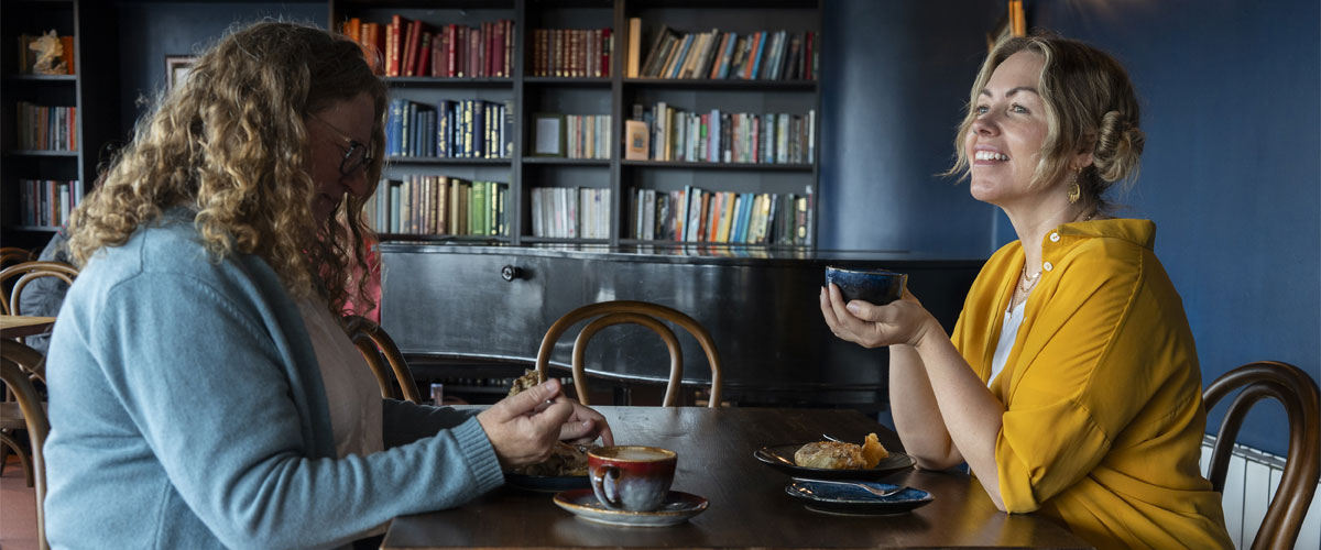 Visitors enjoying food and drink at Howling Wolf Artisan Bakery and Cafe