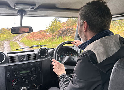 Cumbria Tourism staff member Ben driving off-road with Graythwaite Adventure