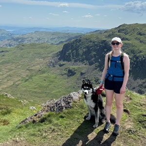 Beatrice Hooson, Senior Finance Executive at Cumbria Tourism, and her husky, Frank