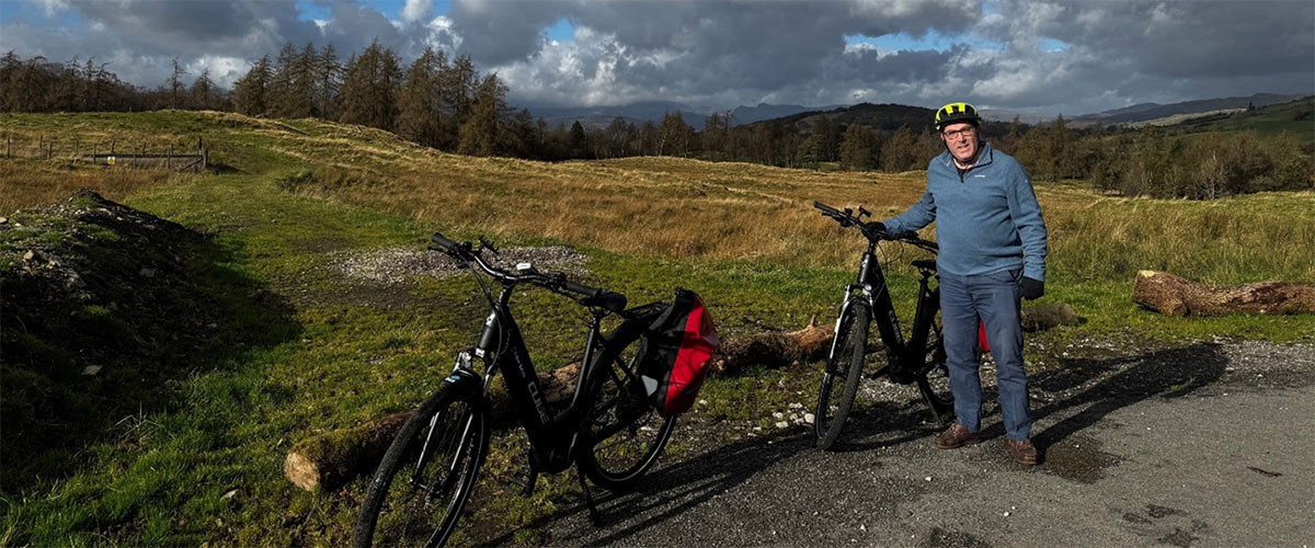 Rob C stops to admire the views in the Lake District countryside with his E-bike from E-bike Safaris