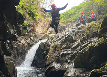 Team Member Rob Rhys leaps into a lagoon at Church Beck