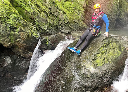 Team Member Rob Davies poses for a photo atop a waterfall at Church Beck