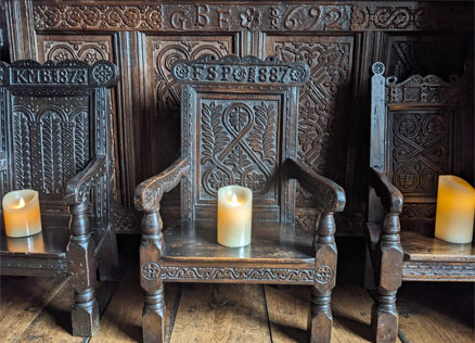 George Browne's iconic woodcarving, as seen on chairs and wall panels at Townend in Troutbeck, Lake District